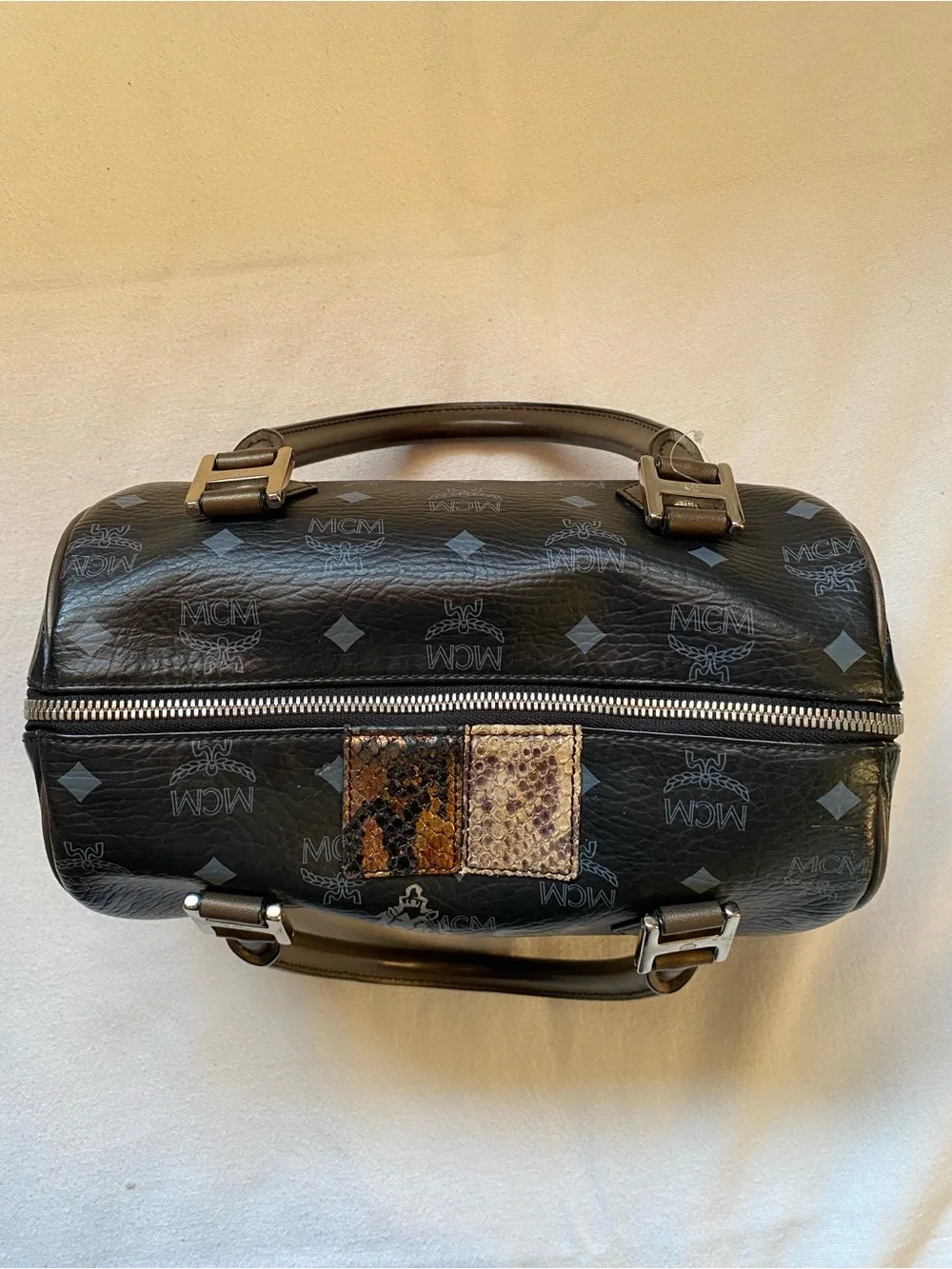MCM Black Leather Boston Bag with Lion Motif and Mixed Snake-Print Accents